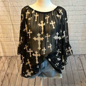 Cross detail top with ruffle sleeve.